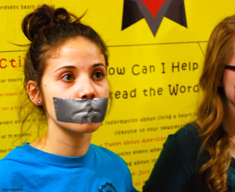 Girl with Mouth Taped Shut