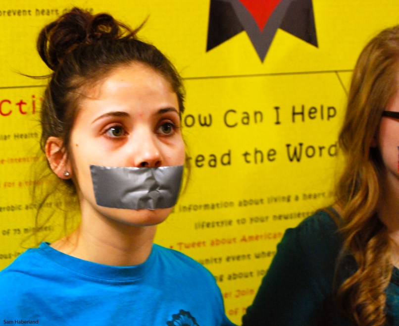 Girl with Mouth Taped Shut