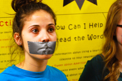 Girl with Mouth Taped Shut